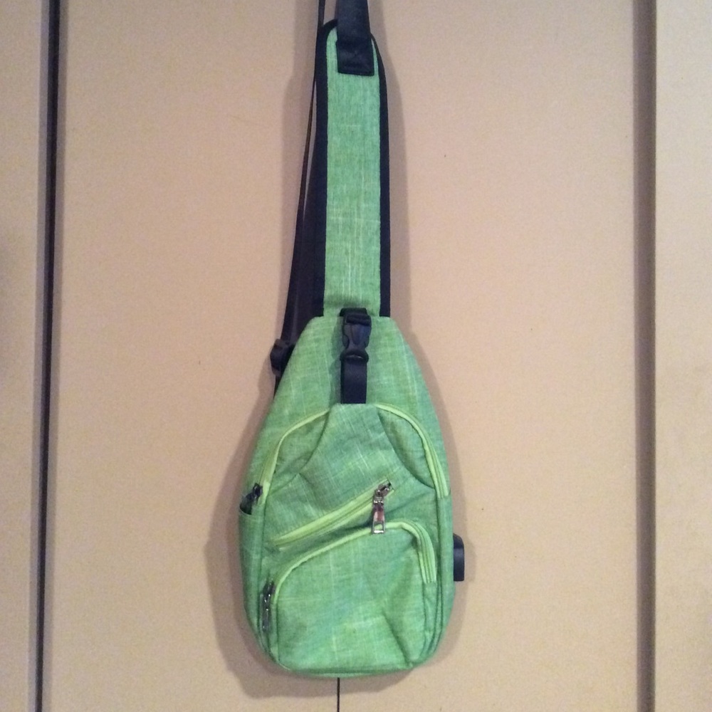 Green Sling Bag With Charging Portal.